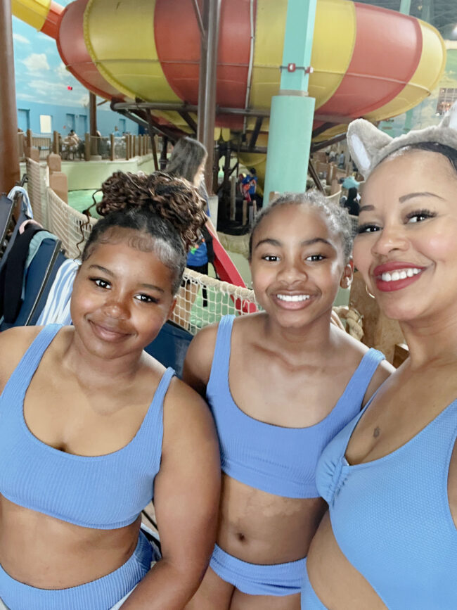 Mother and daughters in matching swimsuits at the Great Wolf Lodge Illinois indoor waterpark 